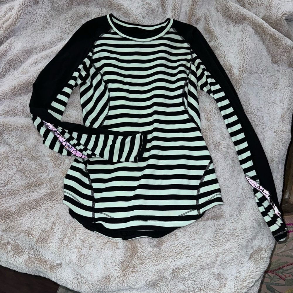Lululemon size 8 Longsleeve Active Shirt excellent condition.